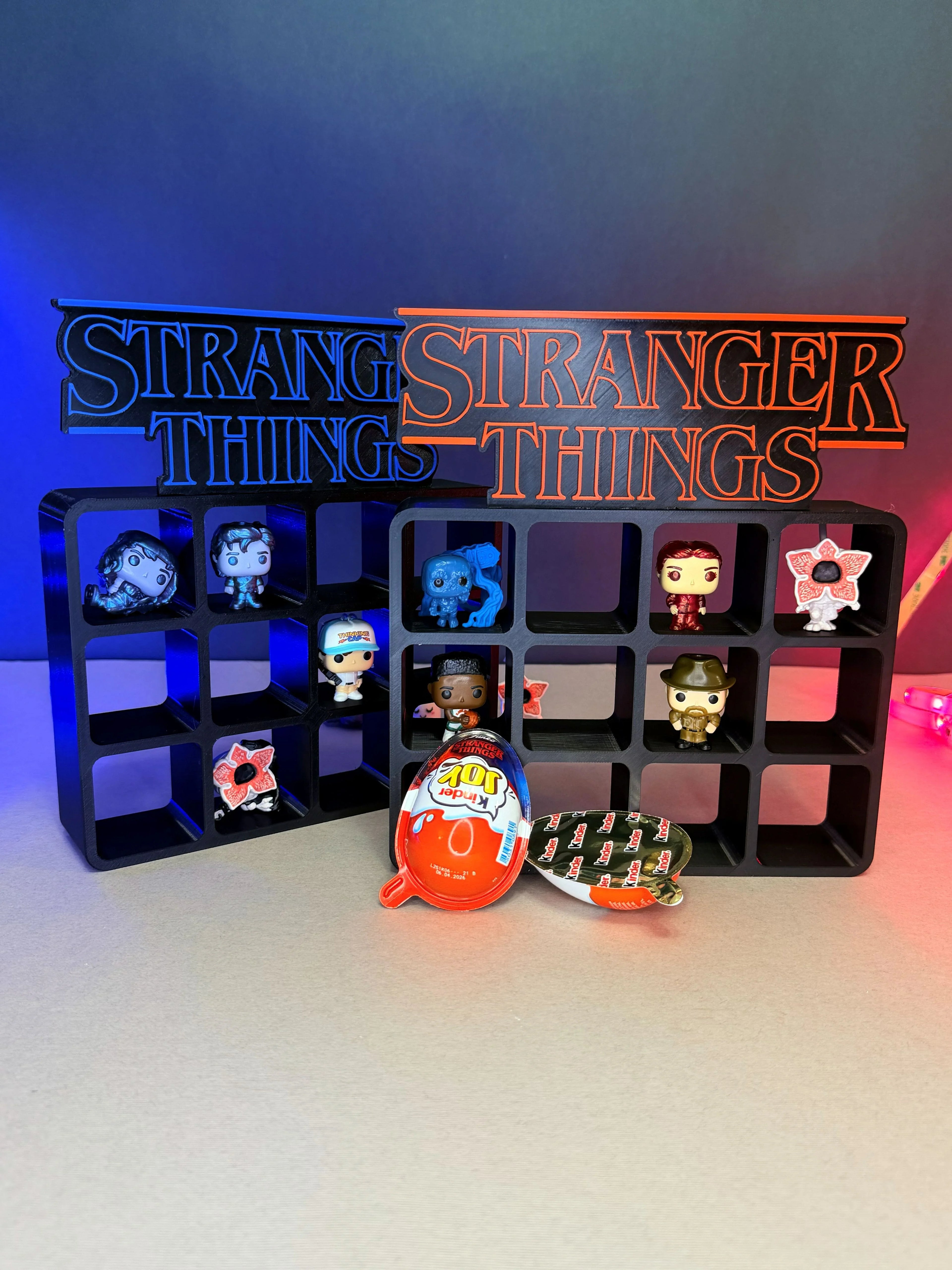 3D printed Stranger Things display shelves with character figurines and Kinder Joy toy capsule