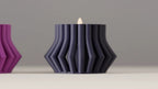 Four ribbed LED tealight holders arranged as a set