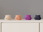 Modern ribbed LED tealight holder with a warm glowing light