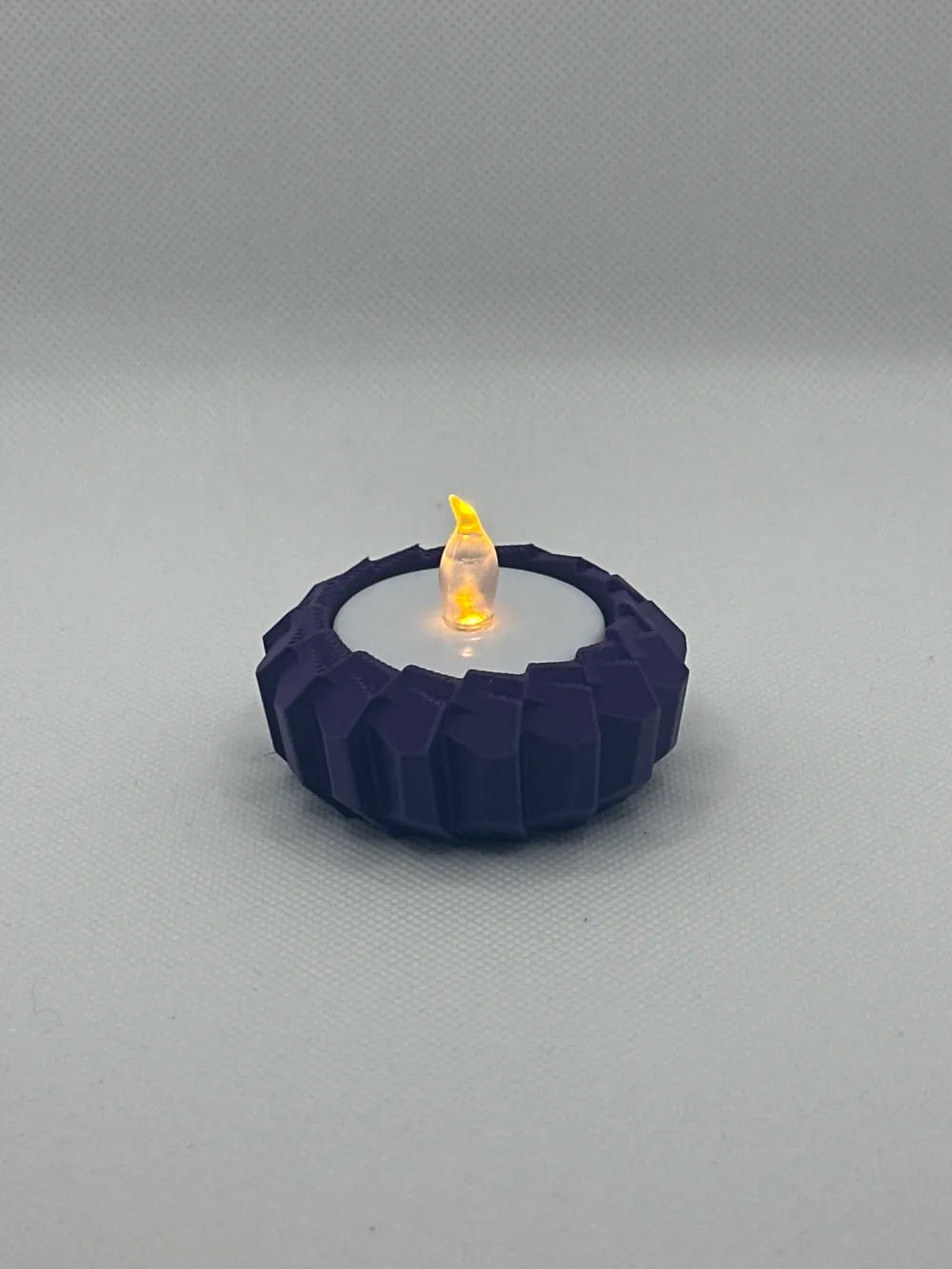 Modern angular LED tealight holder product view in selected colour
