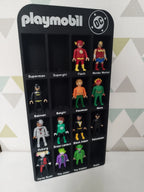playmobil DC superheroes and villains figures display, modern background, organized by name