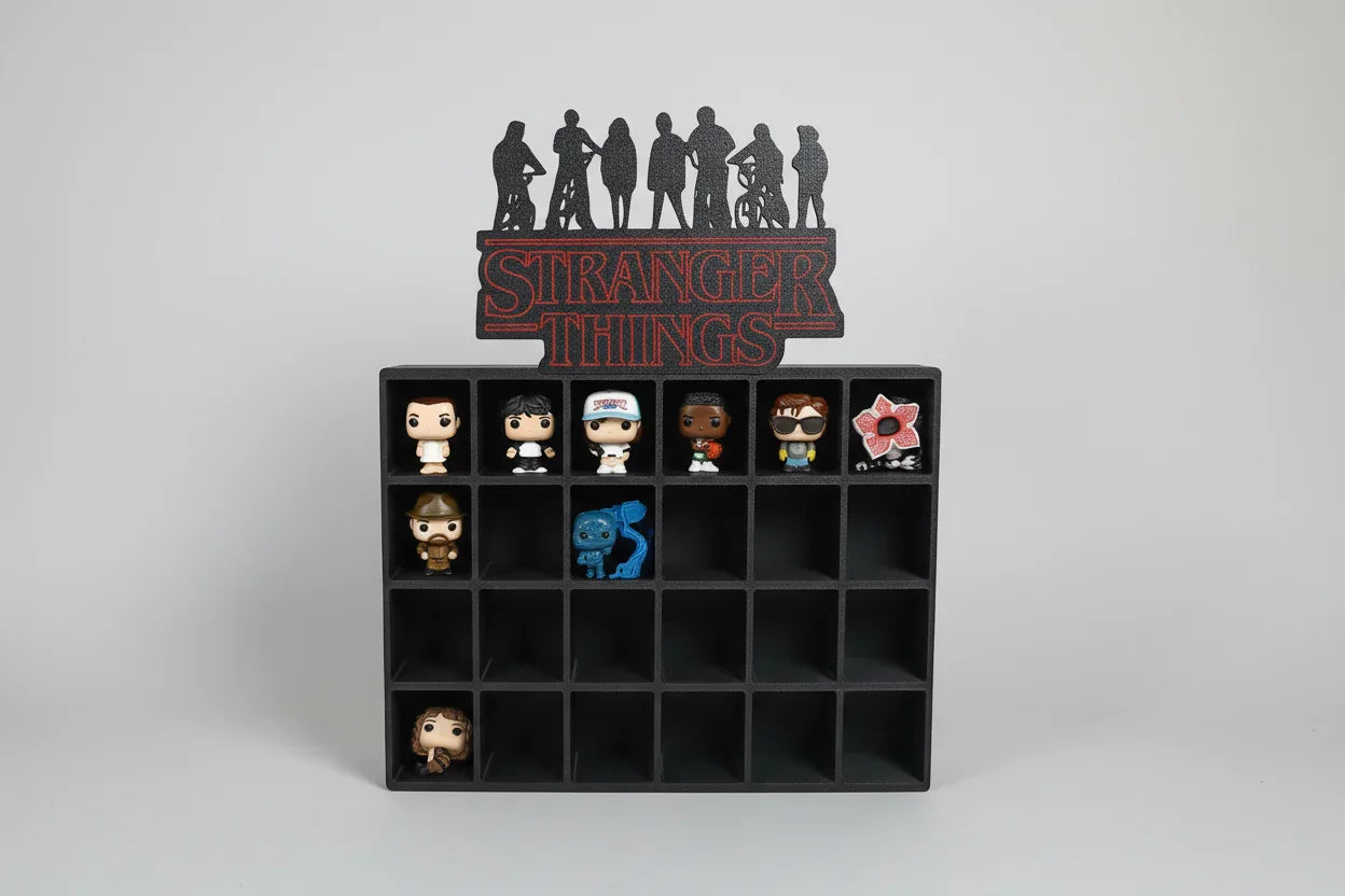 Black display case with 'Stranger Things' themed figurines on a white background
