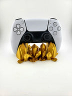 White gaming controller on gold 3D printed crystal stand, modern decor by Lunqo.