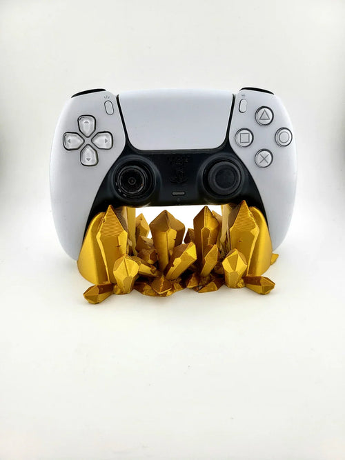 White gaming controller on gold 3D printed crystal stand, modern decor by Lunqo.