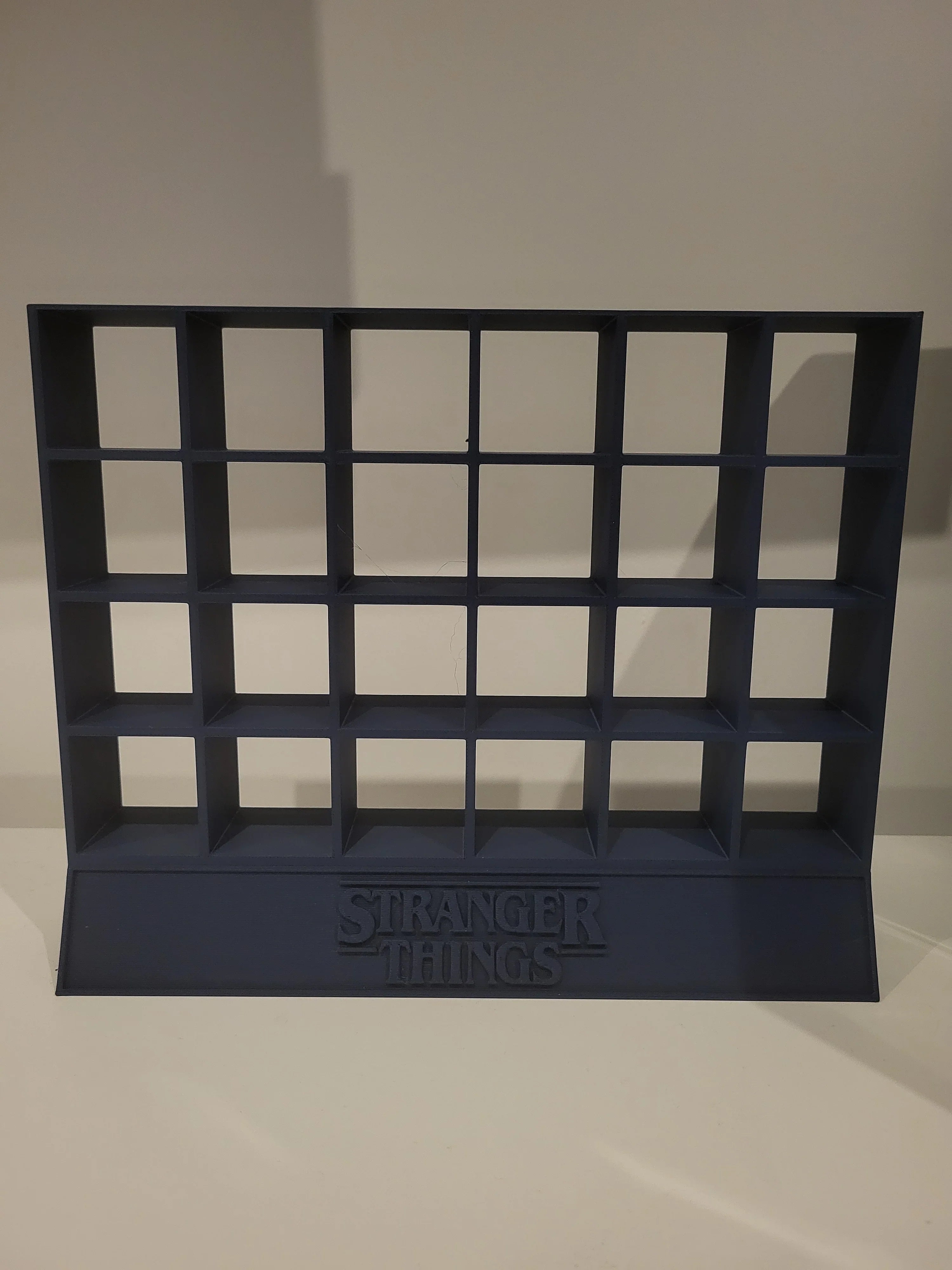 3D printed rack with grid shelves and Stranger Things logo, modern display by Lunqo