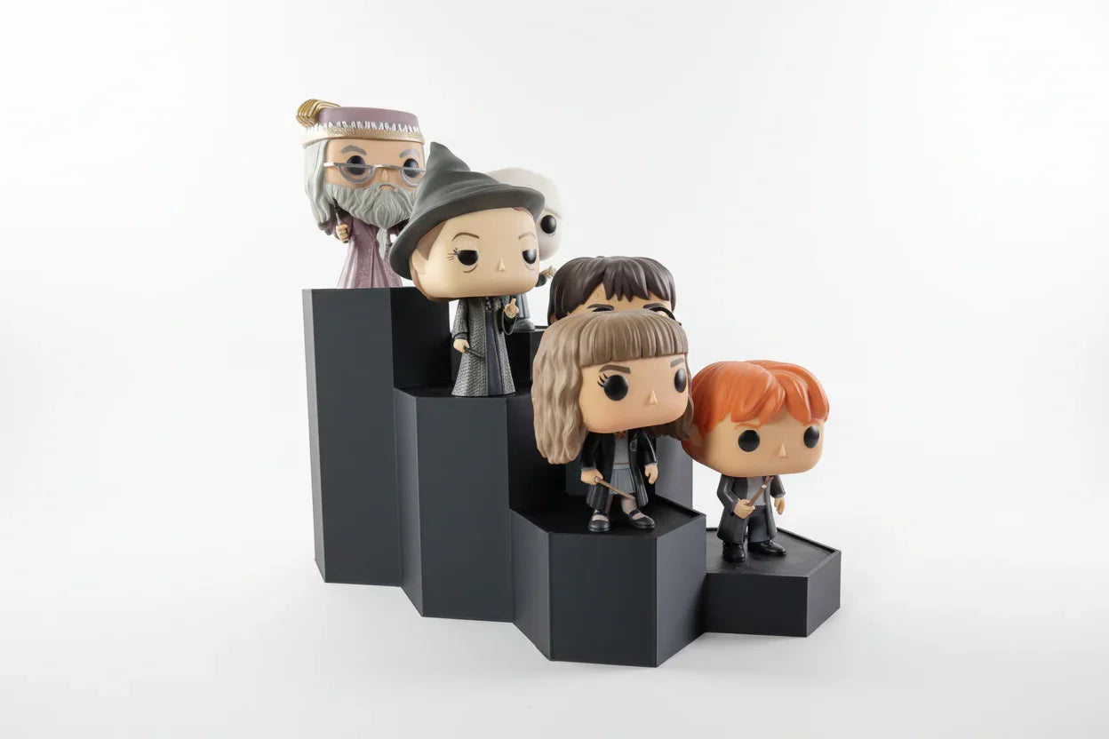 3D printed black display stand holding five Funko Pop figures, modern stepped design by Lunqo