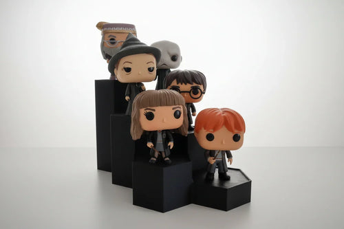 Group of collectible vinyl figures on black modular 3D printed display stands by Lunqo
