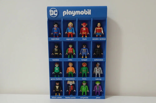 Blue display of Playmobil DC superhero and villain figures with labeled compartments
