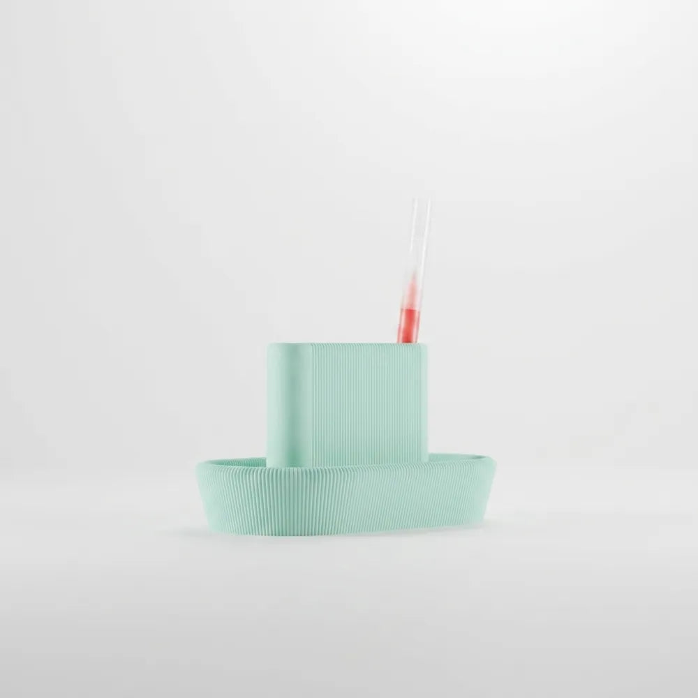 Modern desktop organiser holding pens and small desk accessories
