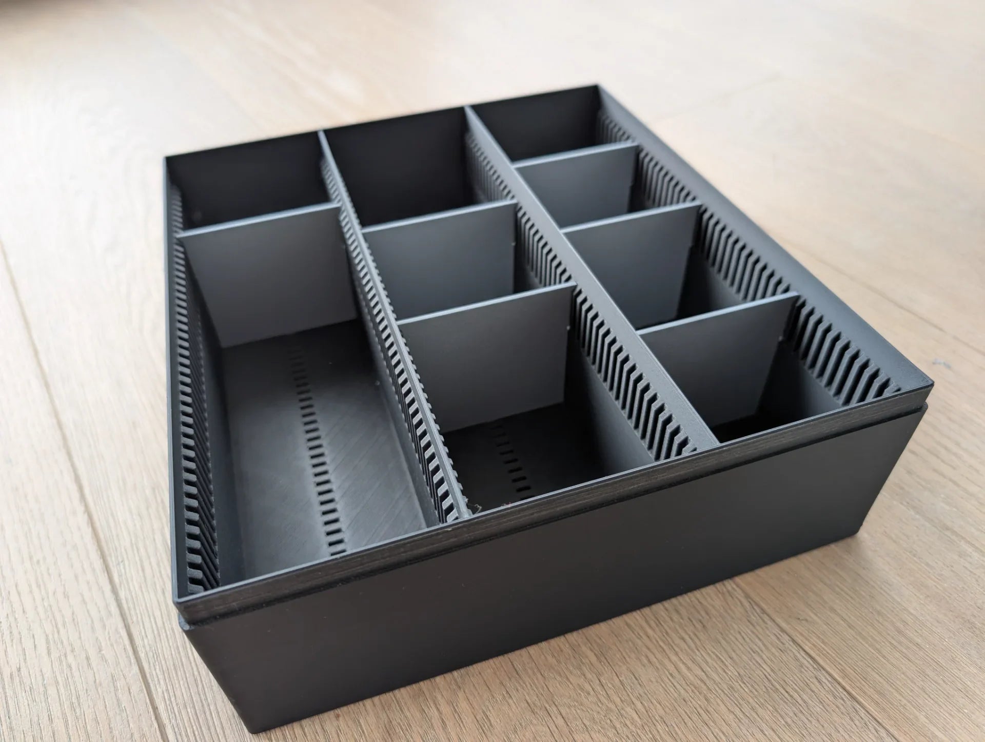 Lunqo premium 3D printed black organizer tray with multiple compartments on wood floor