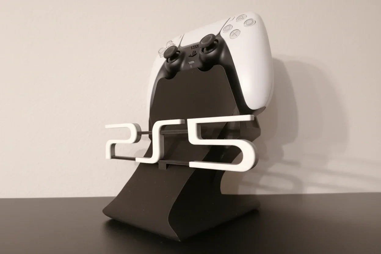 Gaming controller on a stand with 'PS5' branding against a neutral background