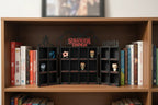 Bookshelf with 'Stranger Things' themed decor and books