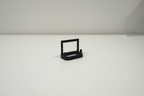 Black 3D printed accessory from Lunqo on a white background, modern minimalist design