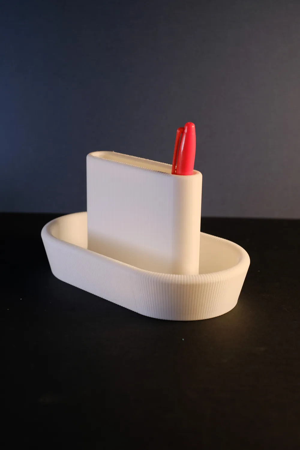 Ribbed desktop organiser with integrated dish for small essentials