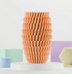 Sea anemone inspired vase shown in a complementary interior setting.