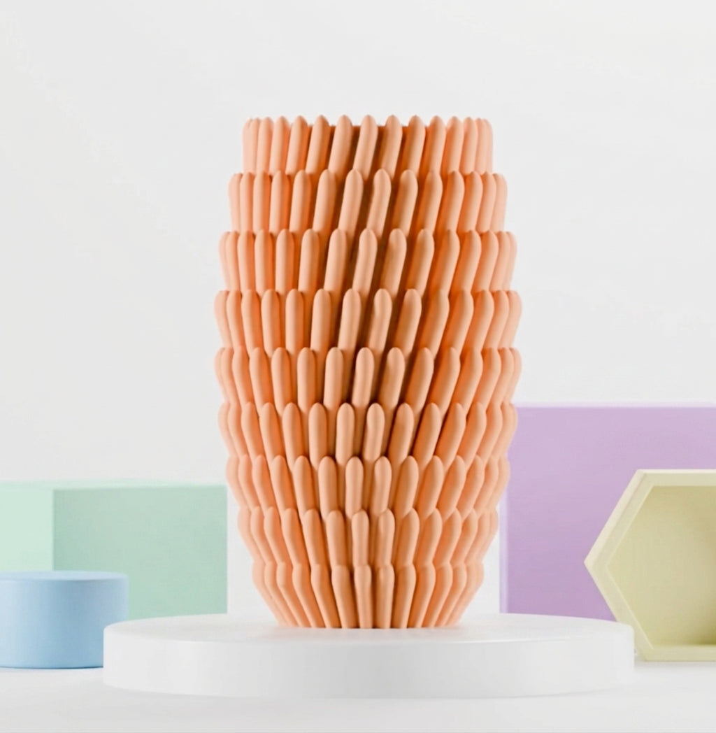 Sea anemone inspired vase shown in a complementary interior setting.