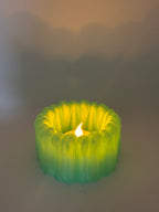 BloomGlow tealight holder casting a soft ambient glow with an LED light