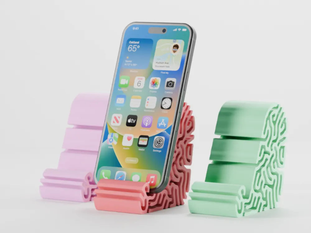 Coral-inspired phone stand holding a smartphone
