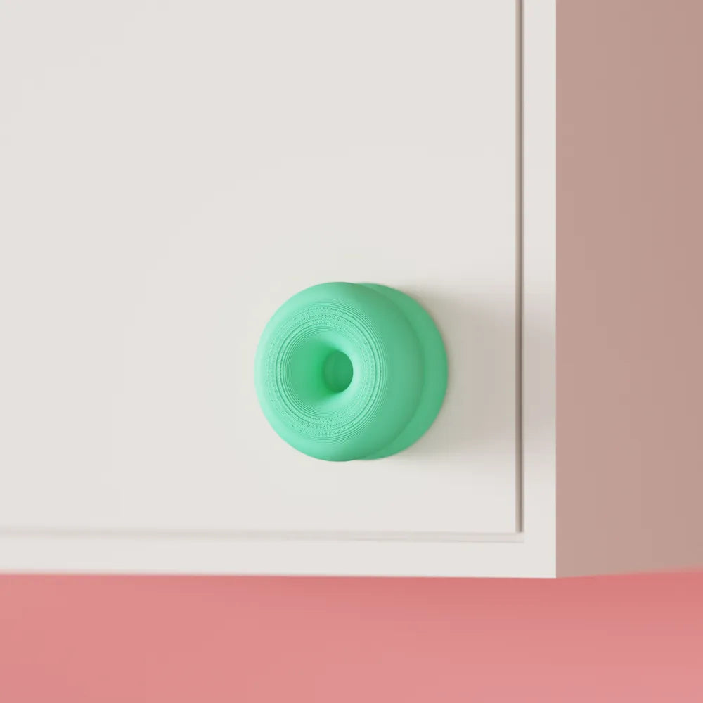Double-donut cabinet handle close-up