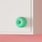 Double-donut cabinet handle close-up
