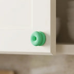Double-donut cabinet handle on a drawer