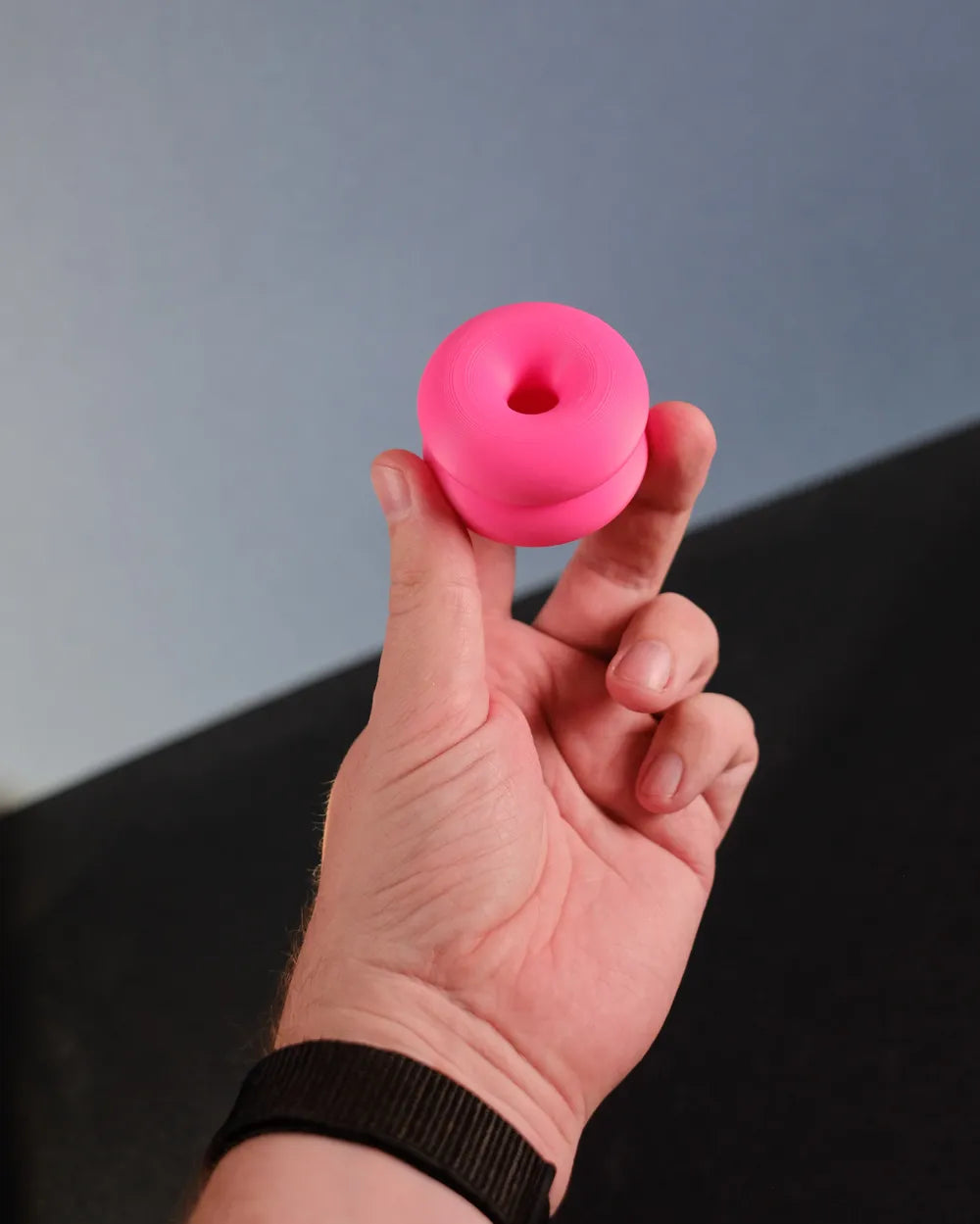 Double-donut cabinet handle in use