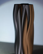 Close-up of the flowing ridged surface on the Flowganic decorative vase.