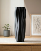 Flowganic decorative vase styled on a wooden sideboard in a modern interior.