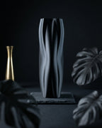Flowganic vase displayed as a dark monochrome home decor accent.
