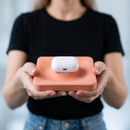 MagSafe phone and AirPods tray styled on a modern desk.