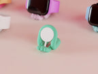 Mint Mini Wibble Apple Watch charger stand holding a magnetic charging puck on a desk