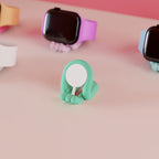 Close view of a mint Mini Wibble stand with the Apple Watch charging puck fitted