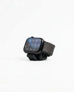 Black Mini Wibble Apple Watch charger stand shown on a clean white background