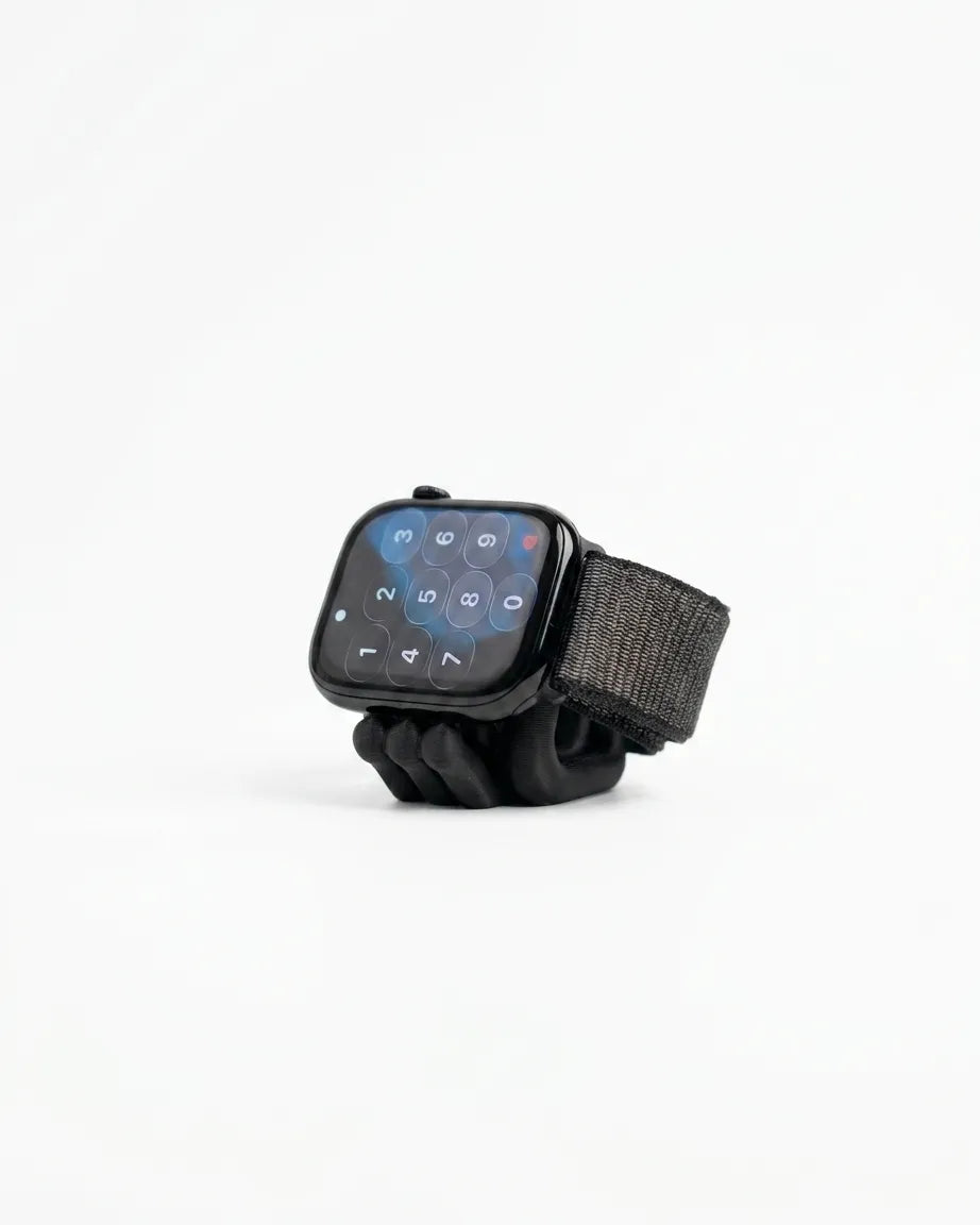 Black Mini Wibble Apple Watch charger stand shown on a clean white background