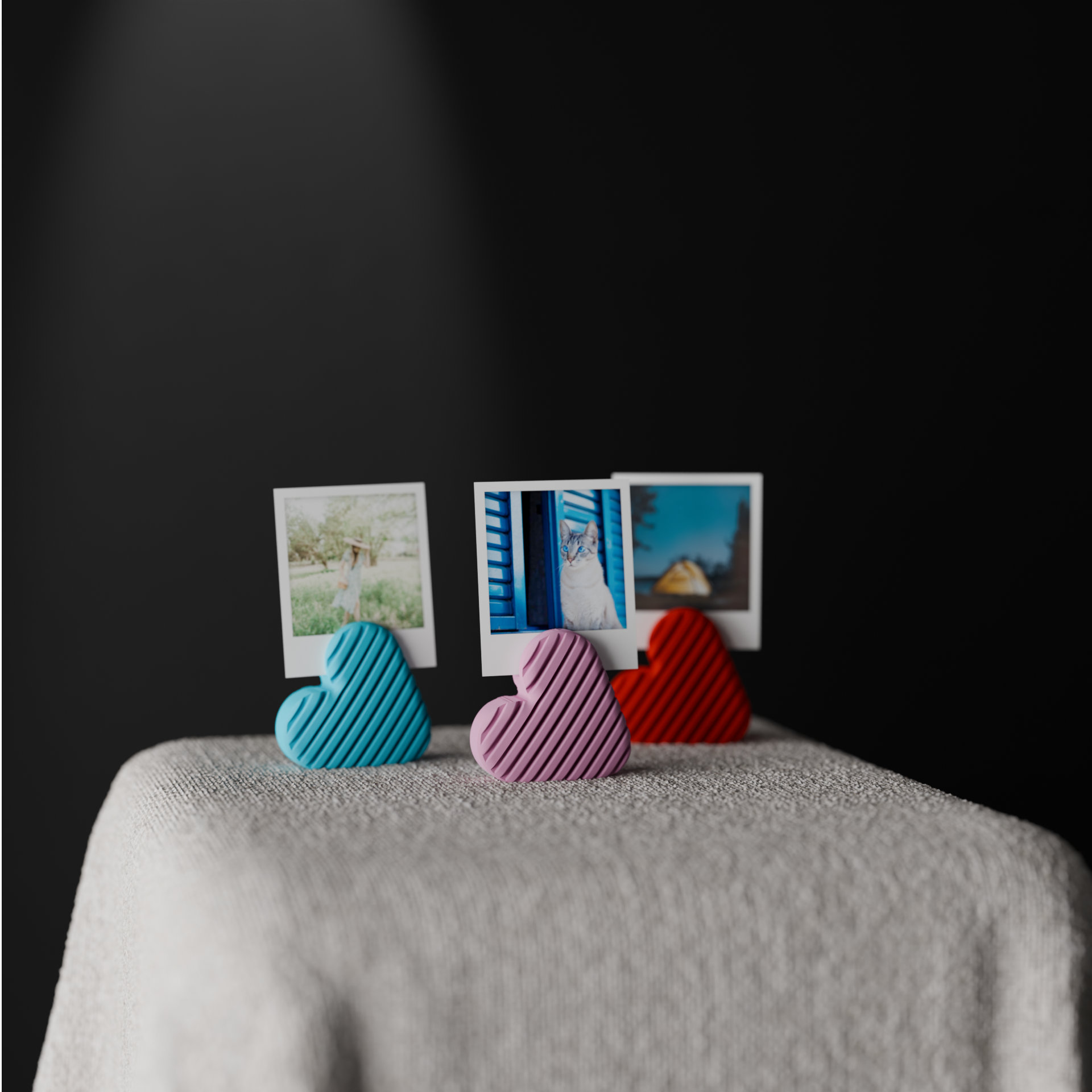 Three heart-shaped photo holders shown from an angled view on a textured display