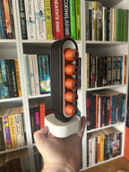 PodArc coffee pod organiser beside a coffee machine