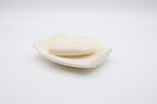 White Rippl soap dish with a bar of soap on a bright white background.