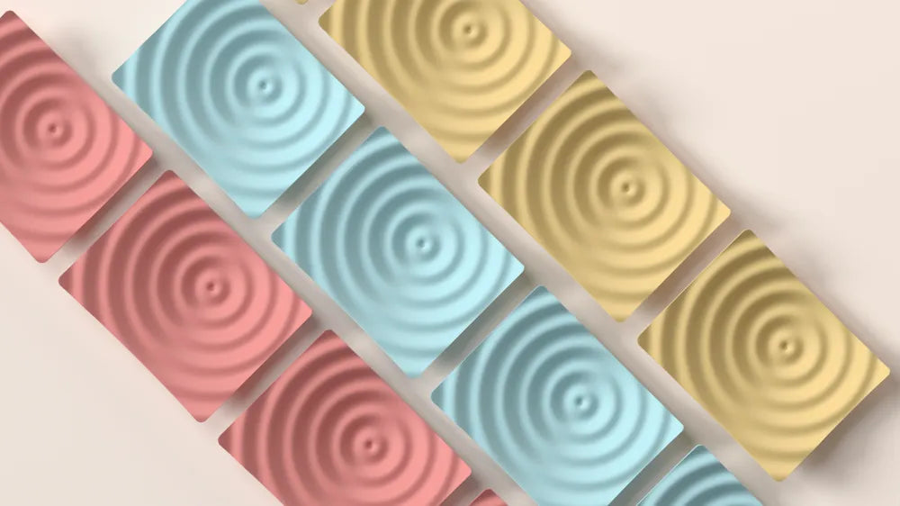 Ripple catch-all tray shown from an angled view with its flowing raised pattern