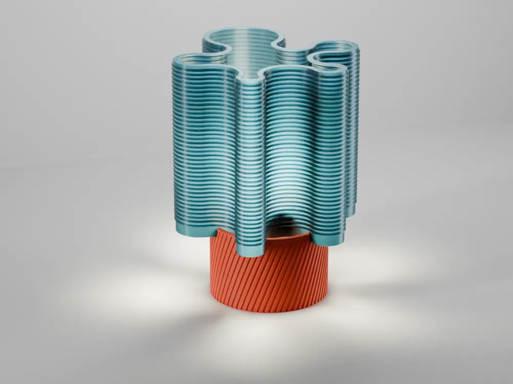 RippleWave E27 table lamp showing a teal wave shade and orange ribbed base
