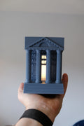 Illuminated Roman temple book nook lamp between books