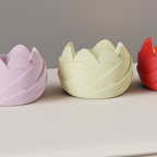 Detailed side view of a cream rose-inspired LED tealight holder beside pink and red versions
