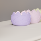 Close-up of a lavender rose-inspired LED tealight holder with layered sculptural petals