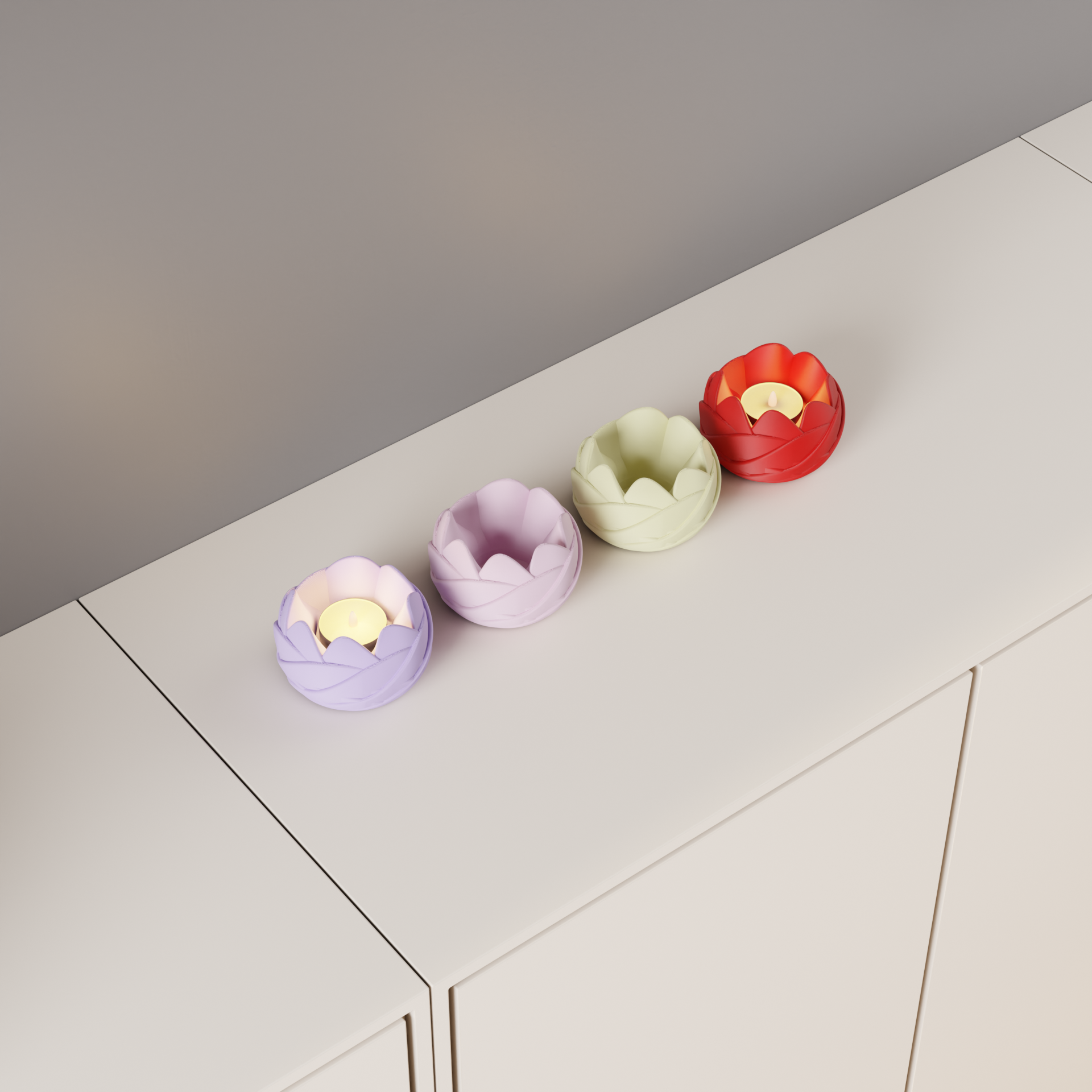 Top angled view of four rose-inspired LED tealight holders in lavender, pink, cream and red