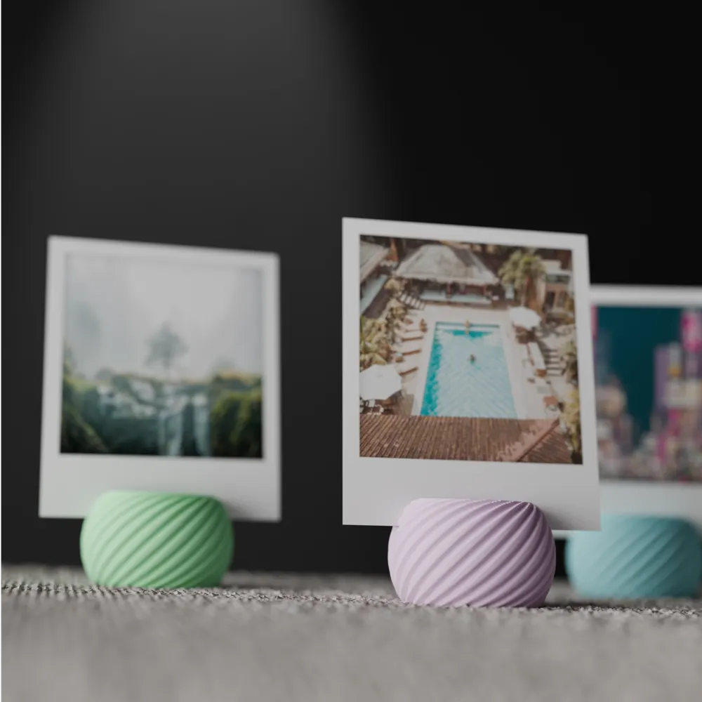 Spiral photo holder displaying an instant photo