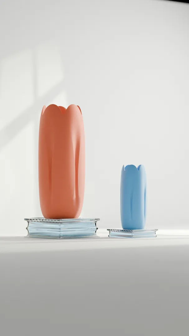 Tulip-inspired decorative vase pair displayed on books