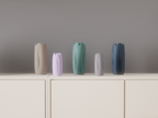 Five tulip-inspired decorative vases in neutral, pastel and dark colours