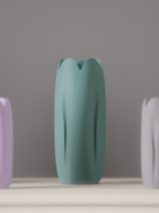 Close view of a mint green tulip-inspired vase with a softly sculpted form