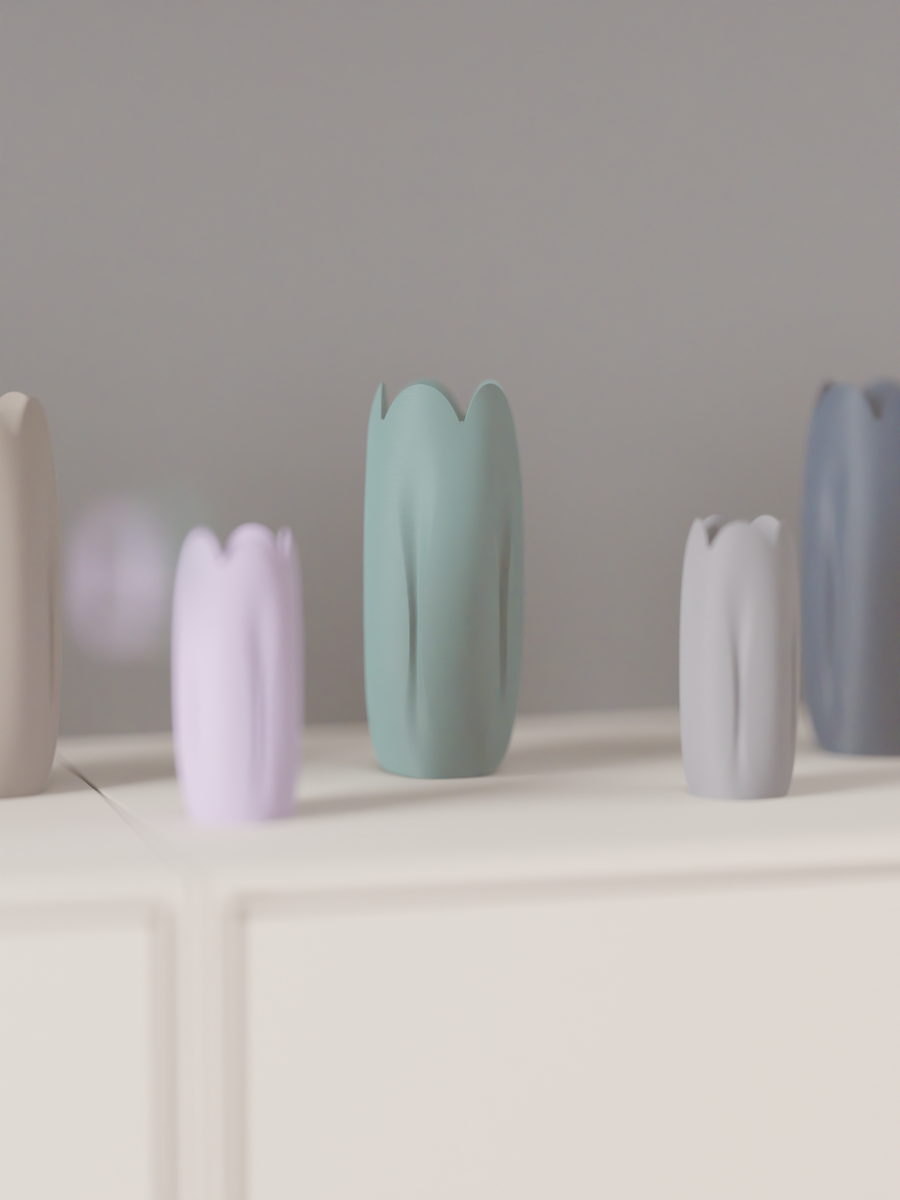 Pastel tulip-inspired decorative vases arranged in several colours on a shelf