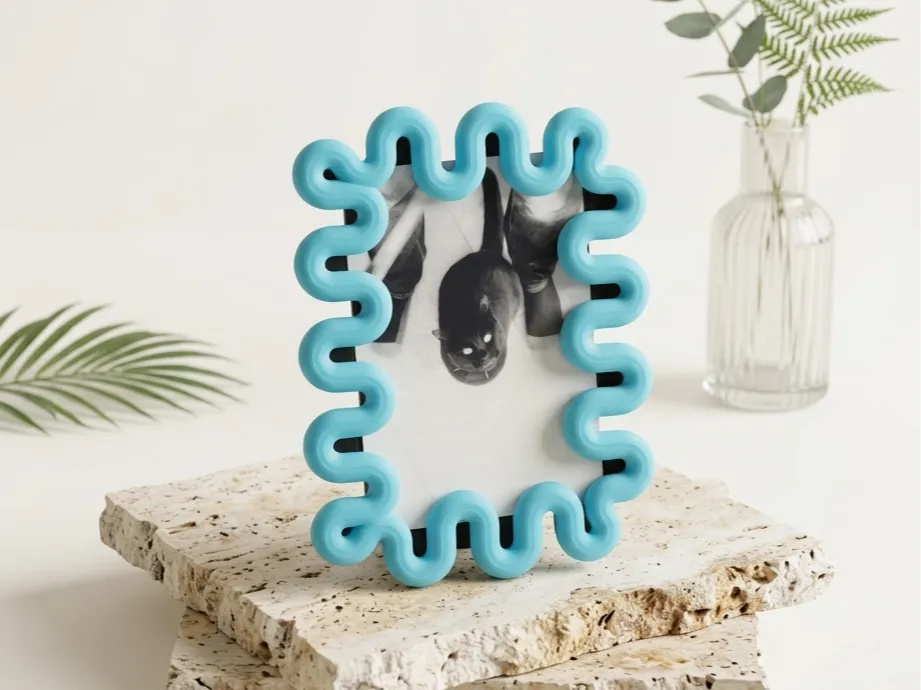 Wibble sculptural photo frame displaying a print