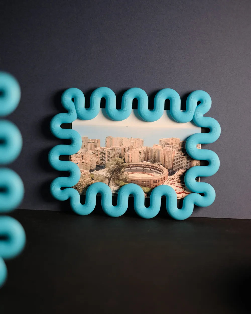 Wibble sculptural photo frame displaying a print